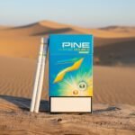 บุหรี่ Pine Change Double Orange มวนสลิม 2 เม็ดบีบกลิ่นส้ม บนพื้นหลังทะเลทรายสีทอง